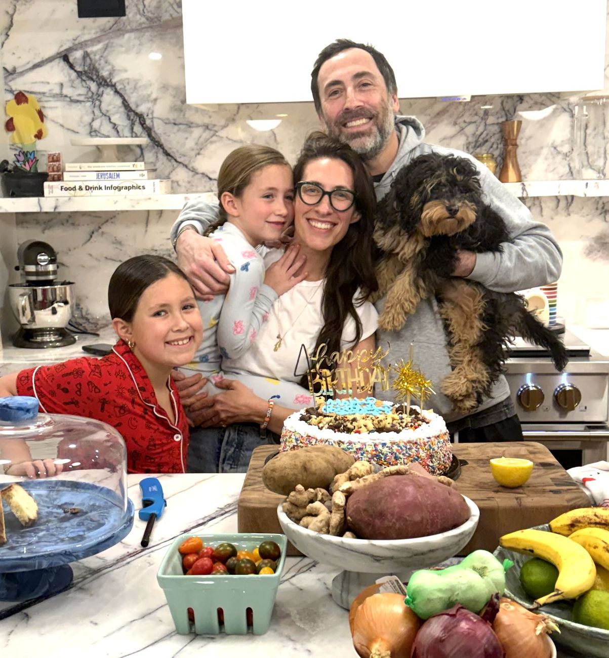Dana with her husband, daughters and dog at a birthday